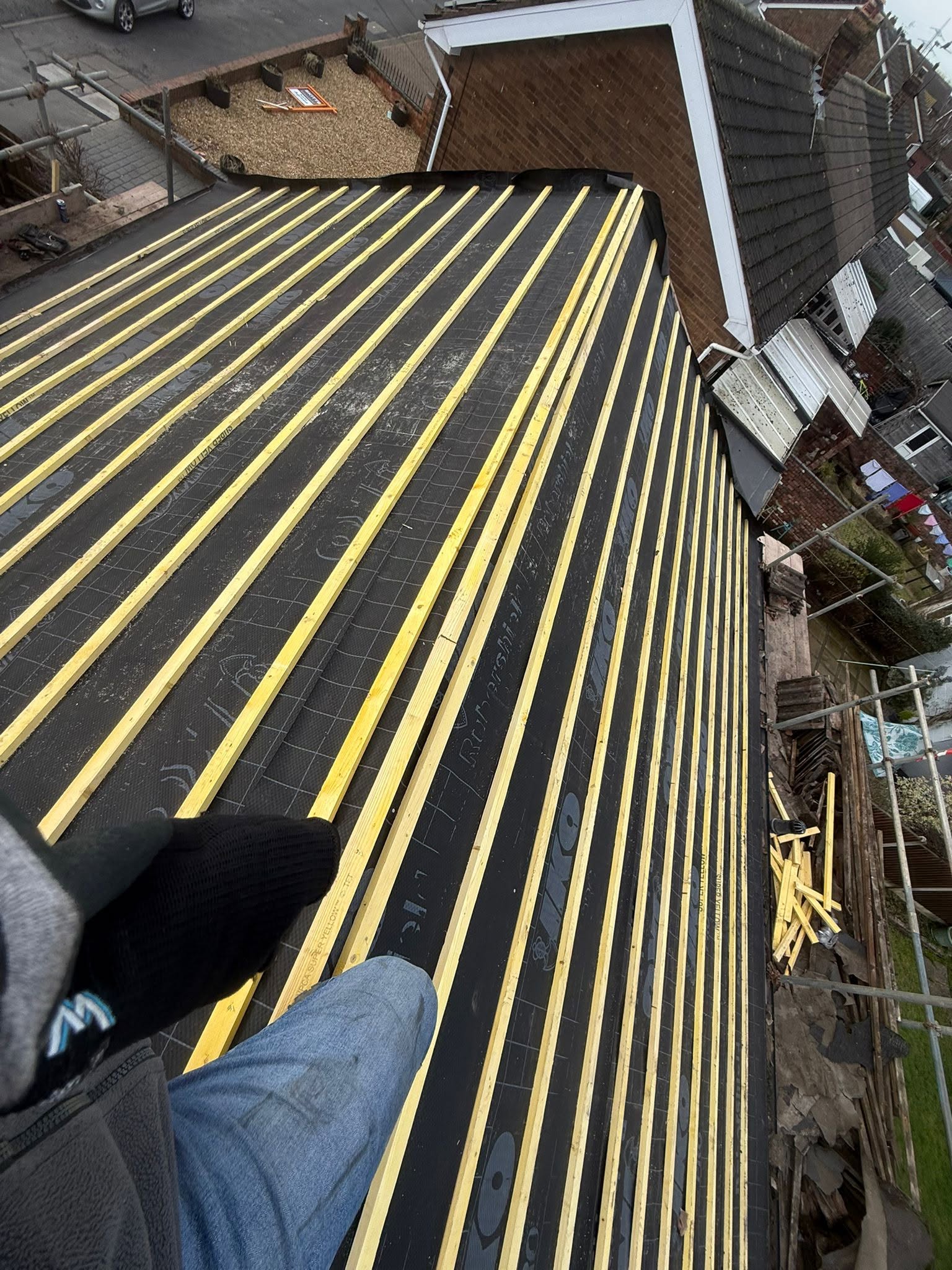 Breathable membrane and treated battens laid across a stripped roof